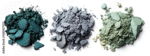 Crushed eyeshadow pigments in teal, gray, and sage green shades