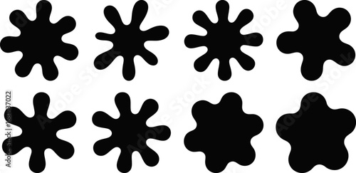 Collection of eight diverse black ink splatter shapes provides abstract design elements isolated on a clean white background for versatile use.
