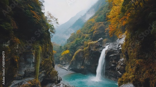 Serene Waterfall Cascading Down Rocky Cliffs Amidst Lush Autumnal Mountain Scenery