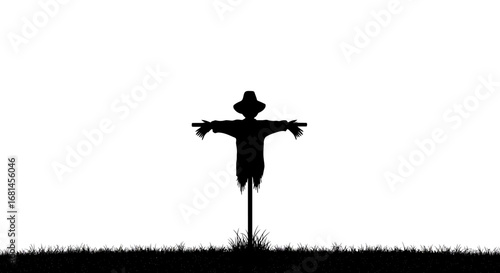 Silhouette of a Scarecrow with Hat and Arms Outstretched.