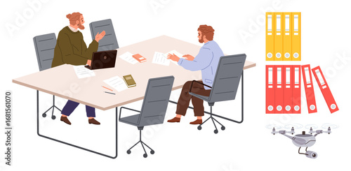 Two colleagues in conversation at a meeting table with laptops, papers, books, and office chairs. Nearby, colorful file folders and a Quadcopter highlight modern office tools. Ideal for teamwork