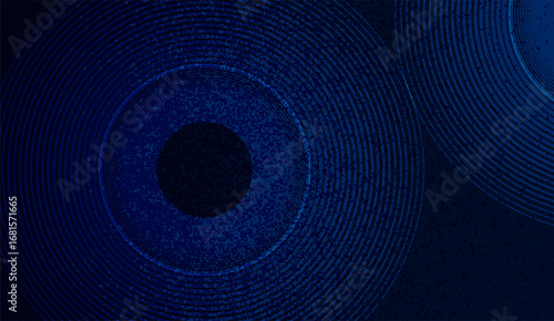 This captivating image features concentric blue circles with a dark central dot, creating a mesmerizing abstract pattern against a textured, deep blue background, making it visually striking
