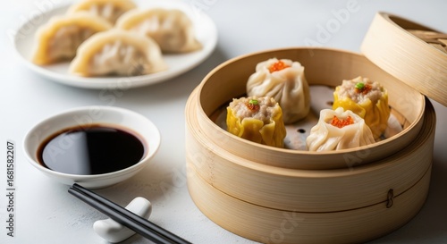3d icon of steamed dim sum dumplings in a bamboo steamer with soy sauce