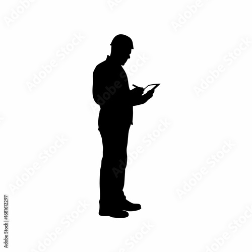 Silhouette of inspector using digital tablet to record results