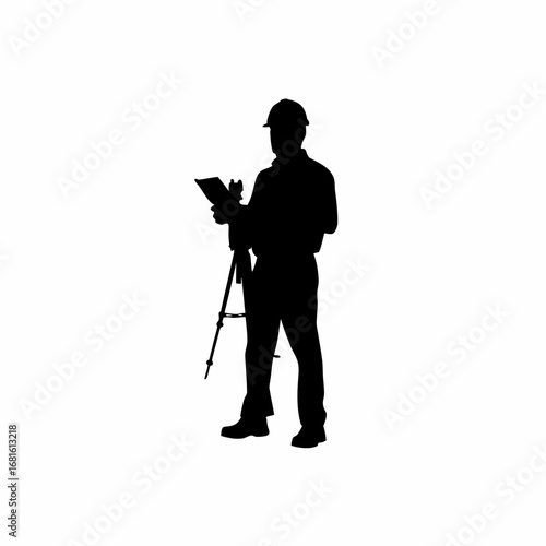 Silhouette of construction inspector documenting site violations with a tablet