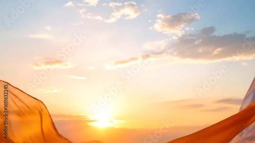 Flowing Fabric at Sunset: Orange and White Silk in the Wind