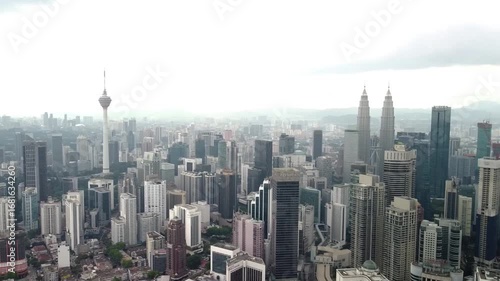 Wallpaper Mural Aerial Drone Pull Back and Pan Right Over Kuala Lumpur Skyline – Iconic Petronas Towers and KL Tower Torontodigital.ca