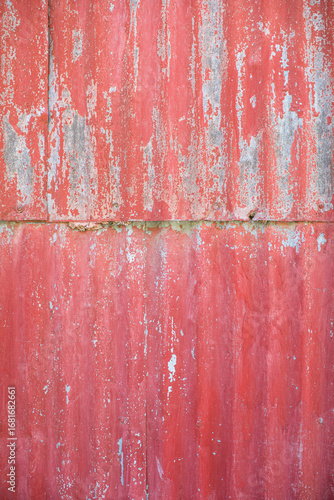 Aged red metal wall

