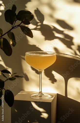 Delightful Cocktail With Golden Hue Showcasing Shadows From Plants Indoors