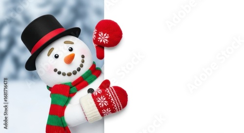 A cheerful snowman with a red and green striped scarf, wearing a top hat and red mittens, peeks around a blank white sign against a snowy background.