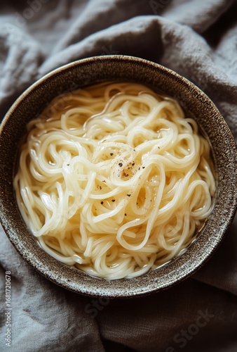 Creamy Pasta Served in a Rustic Bowl on a Textured Cloth in Natural Light