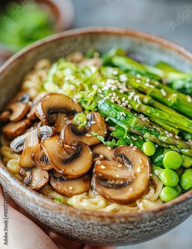 Delicious Bowl of Noodles With Mushrooms and Peas Served in a Rustic Dish.