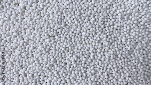 Close-up of background of white granules. Design template. Concept: research, biochemistry, nature, pharmaceutical medicine.