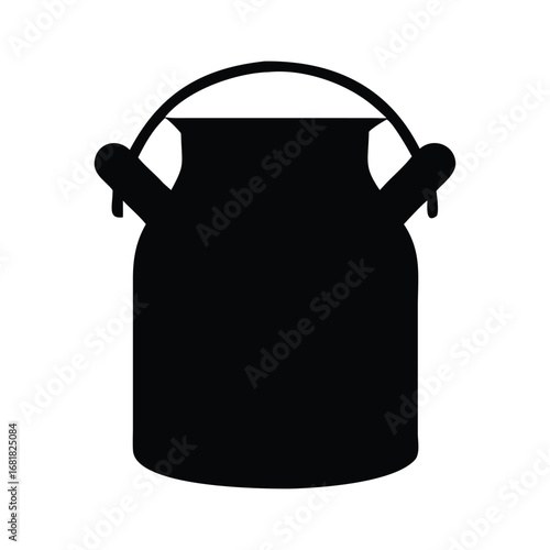 An antique red ceramic old milk jug with a handle sits on a white kitchen counter, a vintage stainless steel pot with a handle rests beside a tea kettle