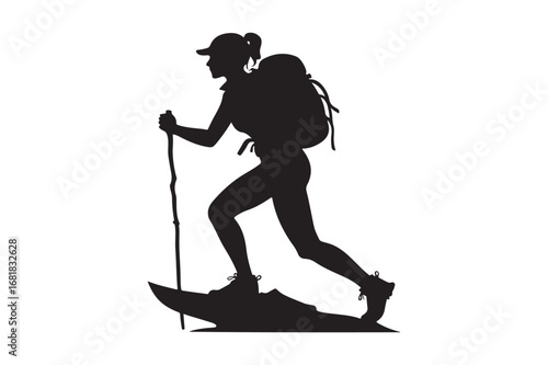 Silhouette of a woman hiking with a backpack and trekking pole