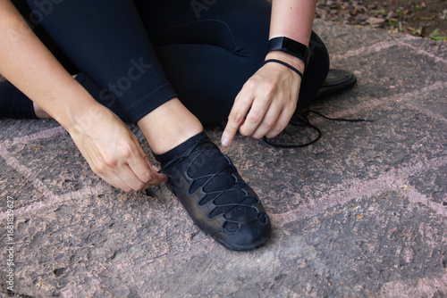 Lacing laces shoes for Irish dance on the floor