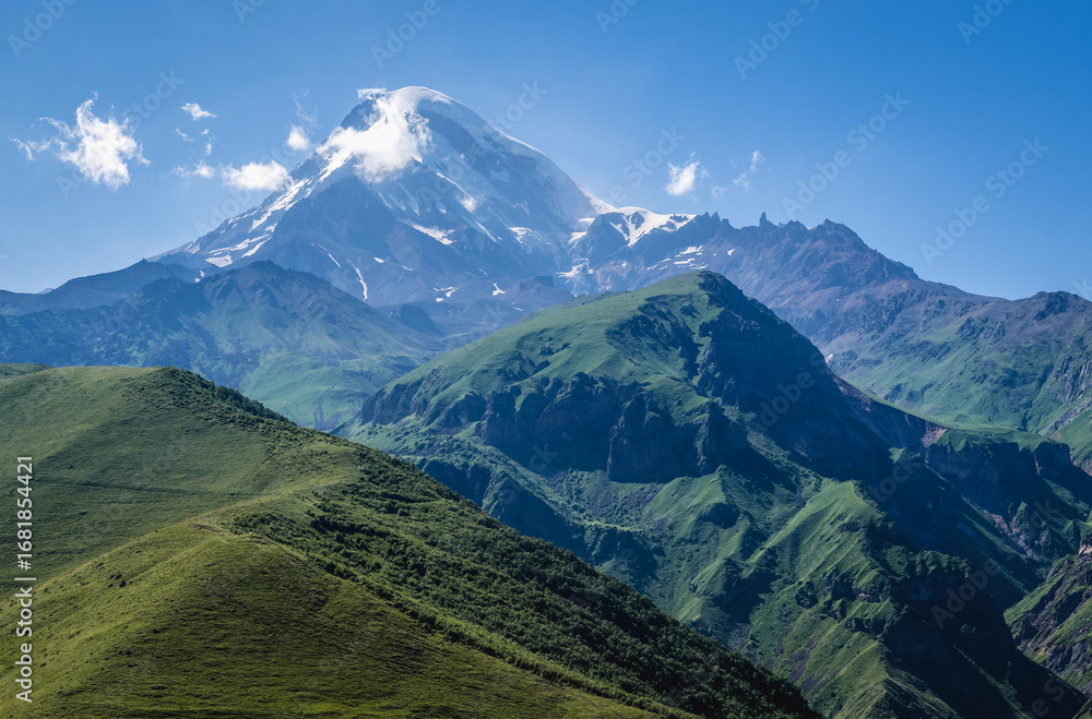 Fototapeta premium Aerial view in Greater Caucasus Mountains with Mount Kazbek near Gergeti village and Stepantsminda town, Georgia