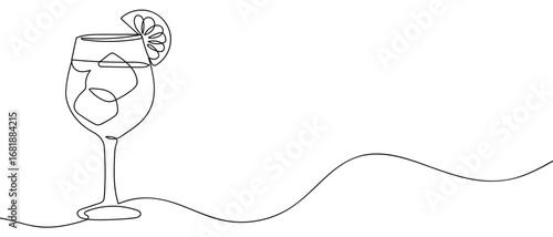 Continuous line of cocktail glass with a slice of lemon. Hand drawn vector art line. Editable stroke.