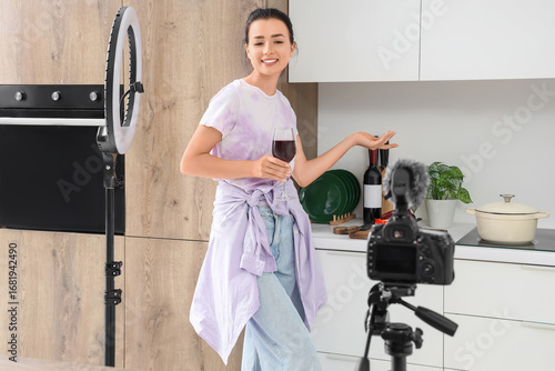 Young woman with glass of w...