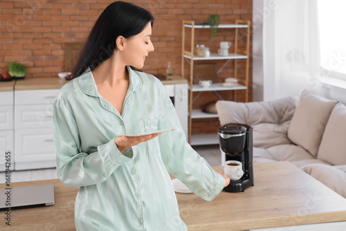 Young woman with tablet com...