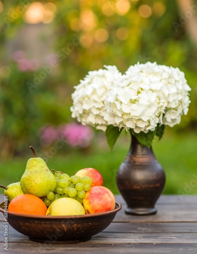 Wallpaper Mural Fruits and flowers on a wooden table Torontodigital.ca