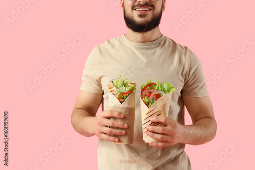 Young man with tasty sandwi...