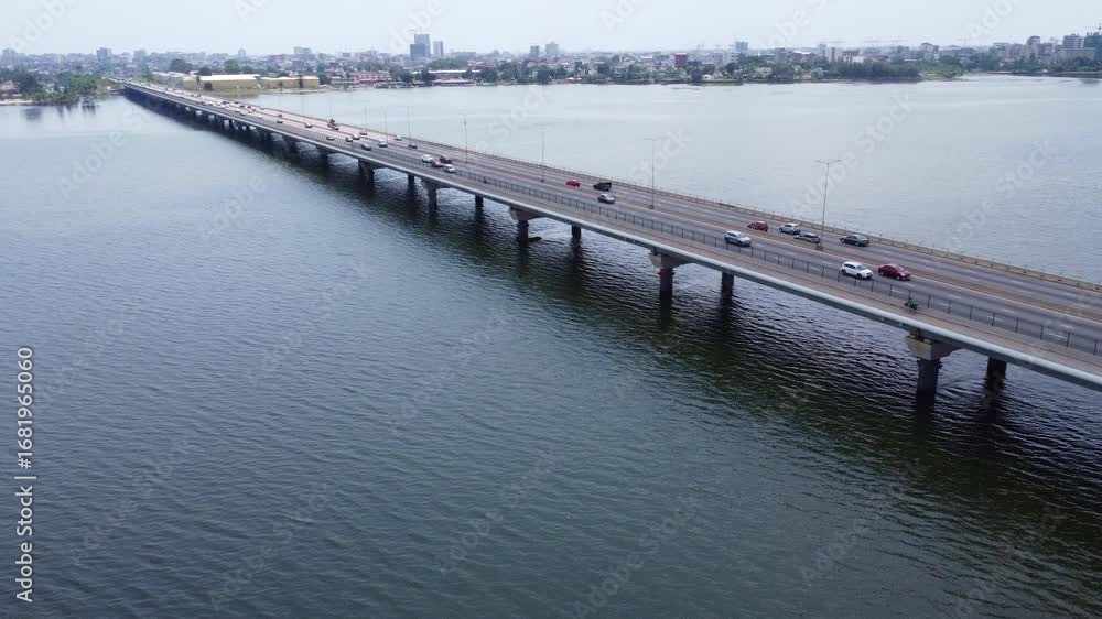 custom made wallpaper toronto digitalAerial View of a Long Bridge Spanning a Body of Water with City Skyline. ivory coast