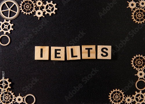 IELTS, text on wood boards against the background of a robotic office