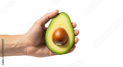 Fresh Ripe Green Avocado Half Held in Hand with Visible Seed and Creamy Texture for Healthy Eating and Nutrition