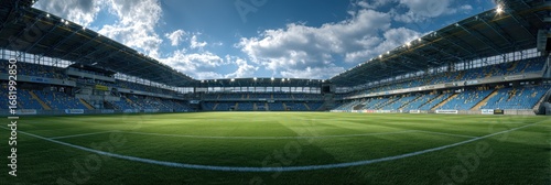 Panoramic view of a modern soccer stadium during a sunny afternoon with scattered clouds