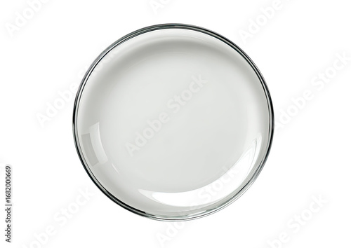 A high-angle, full shot of a round, empty, glossy white plate or dish.  The plate has a clear, thin rim