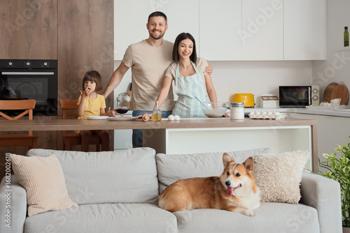 Happy family with Corgi dog...