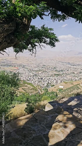 Panoramic view of Sanandaj city from Abidar heights, with distant mountains under a partly cloudy sky.  
📍Abidar, Sanandaj - Kurdisatn 