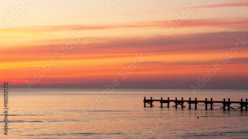 Wallpaper Mural Serene Sunset over Calm Ocean with Wooden Pier Torontodigital.ca
