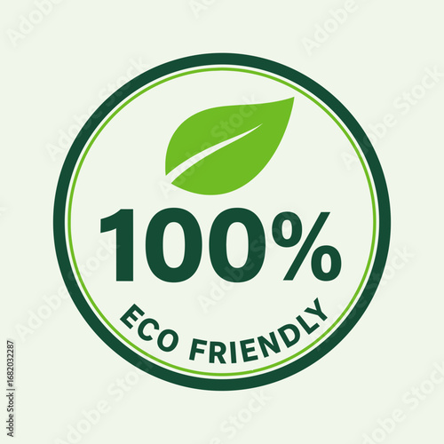 Green eco friendly label with leaf and text on a light background.