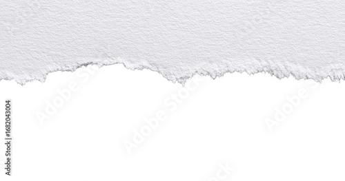 A close-up of a ripped piece of white paper against a black background.  The tear is jagged and uneven, with a textured edge