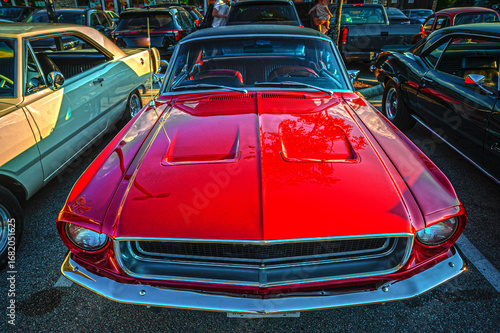 Vintage American muscle cars on display at show and shine.