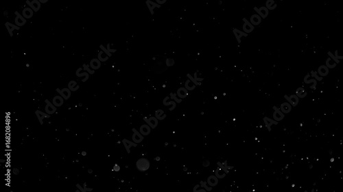 Natural Organic Dust Particles Floating On Black Background. Glittering Sparkling Particles Randomly Spin In The Air With Bokeh. Dynamic Particles With Fast And Slow Motion. Shimmering Dust In Space.	