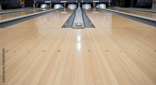 Bowling Alley Lane Perspective: A perspective shot down the polished wooden lanes of a bowling alley, offering a visual journey towards the pins. This image sets a mood for leisurely leisure.