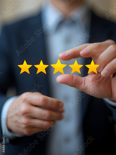 Elevating Excellence: A hand delicately places the final star, completing the perfect rating, symbolizing exceptional customer satisfaction and service quality.