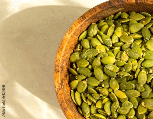 Wallpaper Mural Healthy pumpkin seeds in wooden bowl Torontodigital.ca