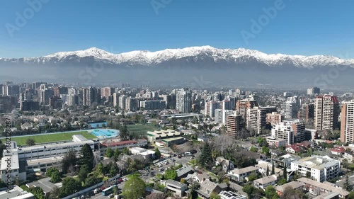 Santiago city in Chile. Aerial view of the skyline of buildings and snowy mountain.