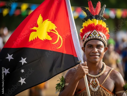 Papua New Guinea Independence Day Celebration with Man in Traditional Attire Holding Flag.