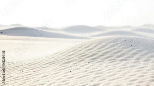 Close Up of White Sand Dunes Featuring a Natural Wavy Pattern Texture In a Bright Sunny Desert Landscape With Clear Sky and Serene Atmosphere