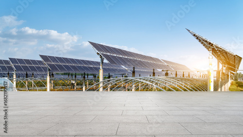 Photos Solar panels array in an open area under a clear sky