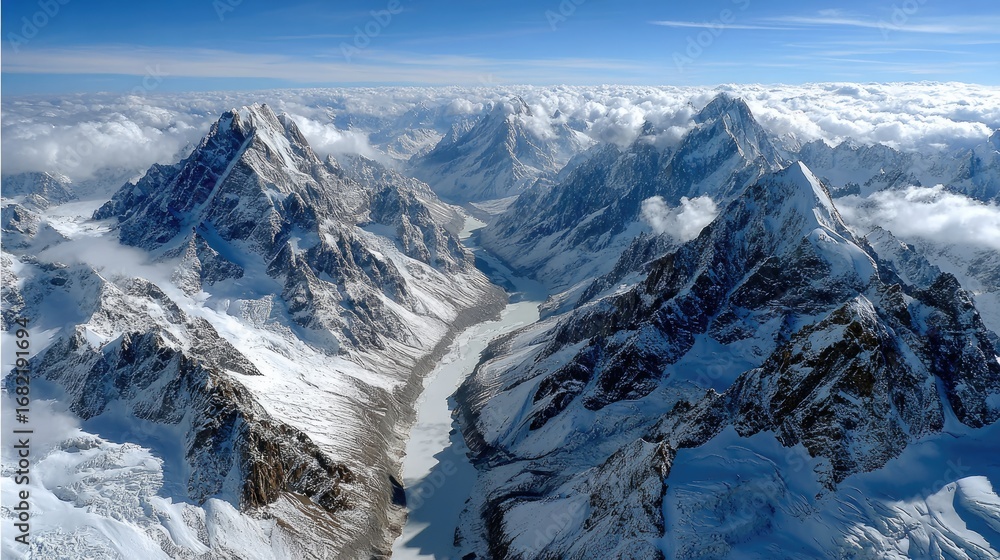 Obraz premium Aerial view of majestic snow covered mountain range