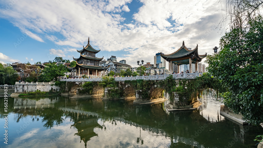 Naklejka premium Traditional Chinese Pavilion by the Calm Lake with Clear Reflections