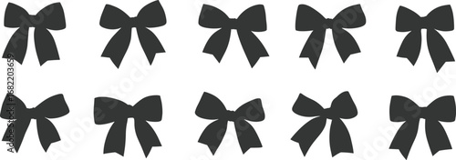 Ten Black Bow Tie Ribbons in Two Rows on White Background gift