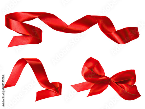 Red satin ribbon streamers and bow, isolated on black