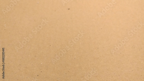 Background of brown kraft paper or cardboard texture, close up of cardboard texture background.
